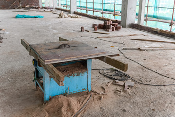 saw cutting machine inside an unfinish industrial loft