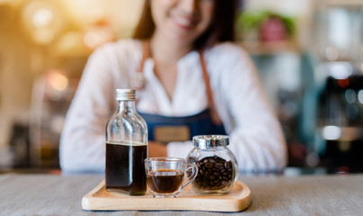 Professional woman Barista present coffee set at front counter serving coffee cup to customer occupation, part-time,job or owner business working woman happy selling and making drink beverage