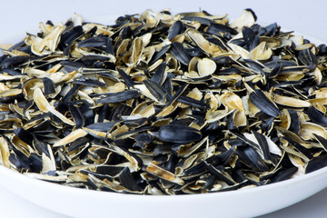 Open the husk of the seeds in the dish,roasted sunflower seeds