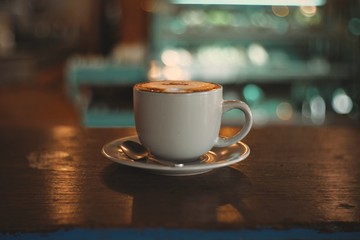 cup of coffee on wooden table