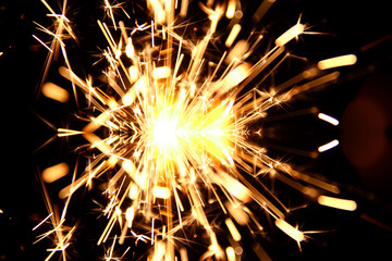 Hand sparkler on black background