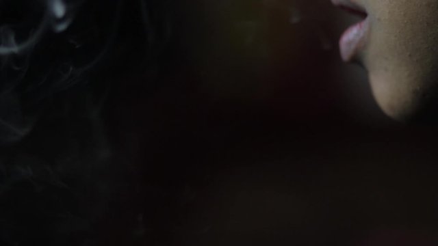 Someone smoking a blunt