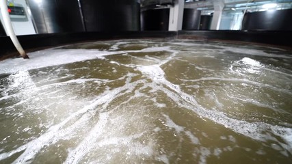 Prawn farm close-up. Oxygen water with aerator inside the shrimp farm.