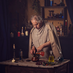 elderly alchemist monk brews  magic potion
