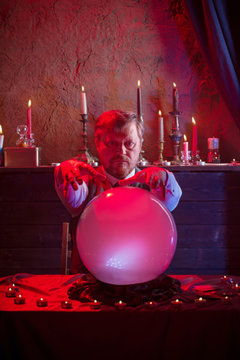 Man Fortune Teller With Illuminated Crystal Ball