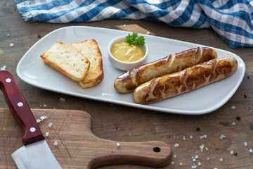 Grilled sausages. Closeup of sausage on the grill. Home-made Sausages. Bavarian sausages