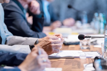 close up of business people taking notes