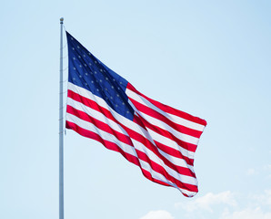 waving USA flag on pole isolated on white