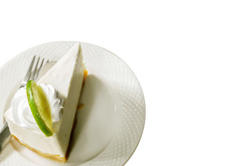 Top view Thai style lime cream cake on white ceramic plate and isolated on white background.