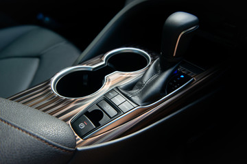 Modern centre console with gear shift, car  driving mode and auto break hole system