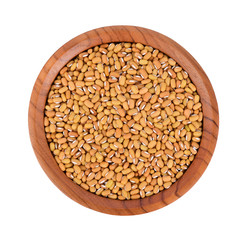 Pea seed in wooden bowl isolated on white background, Top view.