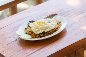A plate of Indonesian fried noodles on the table, Bali, Indonesia