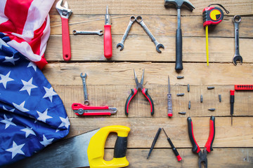 American flag with text of Happy Labor Day on table