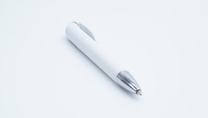 White and silver color ballpoint pen isolated on white background.
