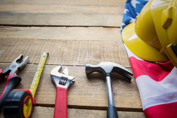 Construction tools on the table with American flag