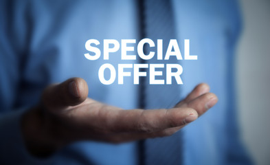 Businessman holding Special Offer text. Business concept