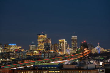 Obraz premium Scene of Boston skyline which can see Zakim Bridge and Tobin Bridge with express way over the Boston Cityscape at twilight time, USA downtown skyline, Architecture and building with tourist concept