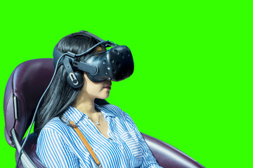 Young woman using a VR glasses to playing a game