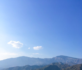 Fototapeta premium Caucasus mountain against the blue sky. Dagestan. Trees, rocks, mountains. Mountain landscape