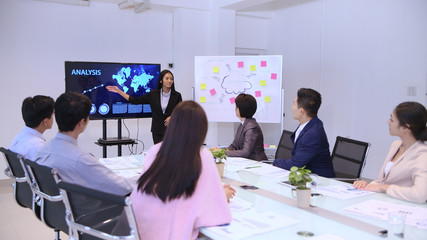 Business concept. Women are presenting work at the meeting.