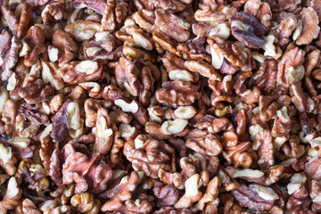 Walnuts kernels top view background. Healthy eating concept.