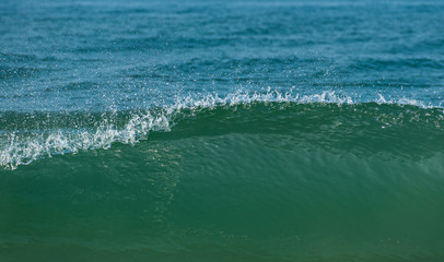 Ocean waves isolated in sky background.