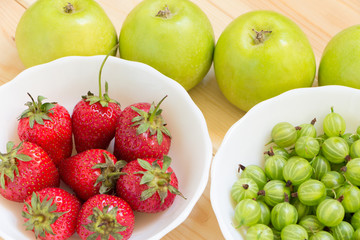 Close up view of delicious fruits and berries from summer harvest. Top view background.