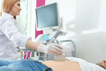 Fototapeta na wymiar Doctor conducting ultrasound examination of internal organs in clinic