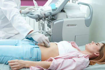 Fototapeta premium Doctor conducting ultrasound examination of internal organs in clinic