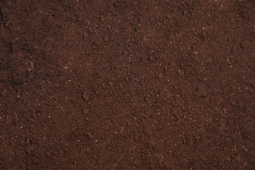Fresh soil for gardening as background, top view