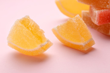 Fototapeta na wymiar Tasty fresh jelly candies on color background