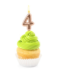 Birthday cupcake with number four candle on white background
