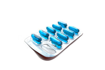 Blue pill capsules package on isolated white background.