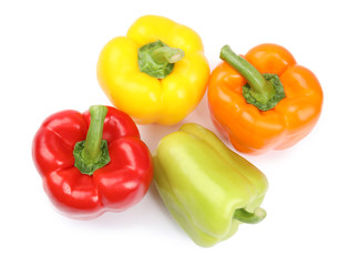 Fresh ripe bell peppers on white background, top view