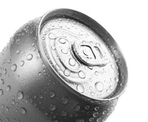 Aluminum can of beverage covered with water drops on white background