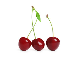 Delicious ripe sweet cherries on white background