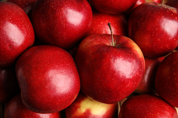 Many ripe juicy red apples as background, closeup