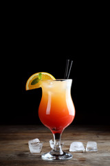 Just made appetizing cocktail Sex on the Beach, black background