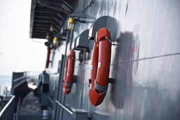 orange lifebuoy ready for use in case of emergency