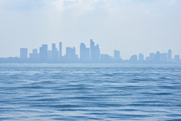Fototapeta premium Seascape View with city background