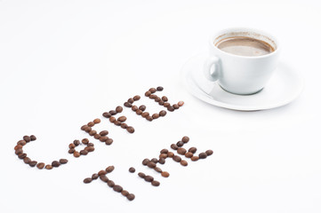 Coffee beans and coffee cup isolated on white background.Coffee time.Copy space.