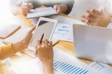 Business concept. Business people discussing the charts and graphs showing the results of their successful teamwork.