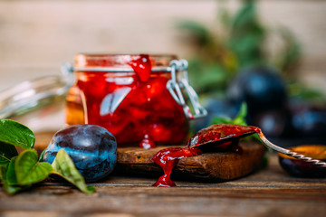 Chutney sauce made from red plum and apples. Indian cuisine. Additive to meat, rice and other dishes. Organic, healthy fruits.Toned image. Selective focus.
