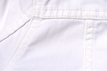 White jeans jacket texture close up. Denim background