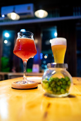 alcoholic drinks cocktails on counter top in night club.