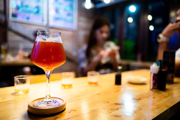 alcoholic drinks cocktails on counter top in night club.