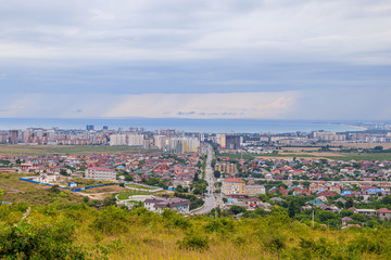 Fototapeta na wymiar View of Anapa. View of the resort city. The vastness of Russia. Russian southern city. City from above. Many houses .. Buildings and architecture