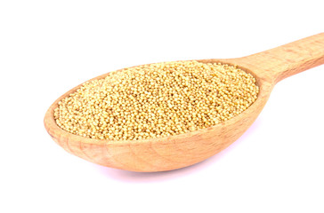 Amaranth seeds in wooden spoon isolated on white background