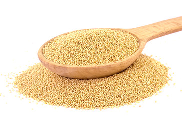 Amaranth seeds in wooden spoon isolated on white background