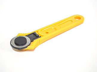 Rotary cutter for garment or textile on white background